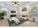 Large main bedroom with tufted headboard and ample light at 4855 Star Hill Ln, Charlotte, NC 28214