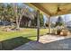 Covered patio with ceiling fan, overlooking the backyard at 4855 Star Hill Ln, Charlotte, NC 28214