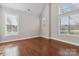 Bright and spacious room with hardwood floors and large windows at 4855 Star Hill Ln, Charlotte, NC 28214