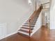 Elegant staircase with wrought iron railings leading to upper level at 4855 Star Hill Ln, Charlotte, NC 28214