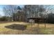 Large backyard with a wooden shelter and mature trees at 510 W Blume St, Landis, NC 28088