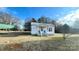 Quaint white house with a covered porch and a spacious yard at 510 W Blume St, Landis, NC 28088