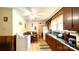 Simple kitchen with wood cabinets and white appliances at 510 W Blume St, Landis, NC 28088