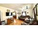 Living room with brown leather furniture and wood floors at 510 W Blume St, Landis, NC 28088