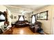 Living room boasts a brown leather sofa and wood floors at 510 W Blume St, Landis, NC 28088