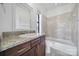 Bathroom with granite countertops, a combined shower and tub, and modern fixtures at 544 New Bern Station Ct, Charlotte, NC 28209