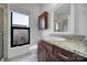 Well-lit bathroom with granite countertops, a vanity, and tile flooring at 544 New Bern Station Ct, Charlotte, NC 28209