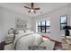 Bright bedroom featuring a ceiling fan, large windows, and hardwood floors at 544 New Bern Station Ct, Charlotte, NC 28209