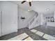 Entryway area with white walls, tile flooring, and a staircase to the upper level at 544 New Bern Station Ct, Charlotte, NC 28209