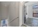 Hallway view leading into the unit, featuring neutral walls, a staircase, and tile flooring at 544 New Bern Station Ct, Charlotte, NC 28209