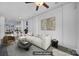 Staged living room boasting neutral decor, tile flooring, and a view of the kitchen at 544 New Bern Station Ct, Charlotte, NC 28209