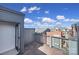 Rooftop deck with concrete tile and metal railings, providing outdoor living space at 544 New Bern Station Ct, Charlotte, NC 28209