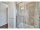 Modern shower with glass doors and tiled walls at 544 New Bern Station Ct, Charlotte, NC 28209