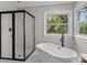 Modern bathroom with freestanding tub and walk-in shower at 5972 Rathlin Nw Ct, Concord, NC 28027