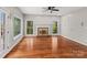 Gathering room with hardwood floors and brick fireplace at 5972 Rathlin Nw Ct, Concord, NC 28027