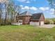 Brick house exterior with deck and garage at 5972 Rathlin Nw Ct, Concord, NC 28027