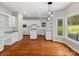 Eat-in kitchen with white cabinets and granite counters at 5972 Rathlin Nw Ct, Concord, NC 28027