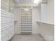 Large walk-in closet with shelving and drawers at 5972 Rathlin Nw Ct, Concord, NC 28027