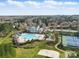 Overhead view of community featuring a swimming pool, playground, and tennis courts, with houses in the background at 6007 Cadence Ln, Indian Land, SC 29707