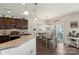 Open-concept kitchen and dining area with sliding glass doors that brighten with natural light at 6007 Cadence Ln, Indian Land, SC 29707