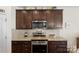 Granite countertop kitchen featuring stainless steel oven and microwave at 6007 Cadence Ln, Indian Land, SC 29707