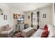 Stylish living room with cozy seating, a modern desk, and large windows, creating a perfect relaxation and work space at 6007 Cadence Ln, Indian Land, SC 29707