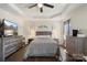 Spacious main bedroom with tray ceiling, ceiling fan, and hardwood floors at 6007 Cadence Ln, Indian Land, SC 29707