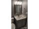 Modern bathroom with vanity, mirror, and updated fixtures at 6106 Meadow Rose Ln, Charlotte, NC 28215