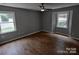 Spacious bedroom with hardwood floors and large windows at 6106 Meadow Rose Ln, Charlotte, NC 28215