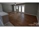 Spacious living area with hardwood floors and access to a patio at 6106 Meadow Rose Ln, Charlotte, NC 28215