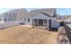 Exterior shot of a backyard with a screened porch and brick paver patio at 6503 Georgia Oak Rd, Charlotte, NC 28269