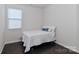 Simple bedroom design with hardwood floors and a window providing natural light at 6503 Georgia Oak Rd, Charlotte, NC 28269