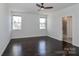 Bright main bedroom with hardwood floors and dual windows at 6503 Georgia Oak Rd, Charlotte, NC 28269