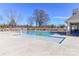 Large, pristine community swimming pool with a shallow wading area for children at 6503 Georgia Oak Rd, Charlotte, NC 28269