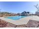 Community pool with clean, clear water, surrounded by lounge area and landscaping at 6503 Georgia Oak Rd, Charlotte, NC 28269