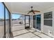 This screened porch has a ceiling fan and views of the backyard at 6503 Georgia Oak Rd, Charlotte, NC 28269