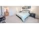 King-size bed in bright bedroom with a view of the kitchen and a guitar at 6525 Gopher Rd, Indian Land, SC 29707