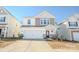 Two-story house with a white garage door and stone accents at 6525 Gopher Rd, Indian Land, SC 29707