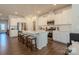 White kitchen with stainless steel appliances and an island at 6525 Gopher Rd, Indian Land, SC 29707