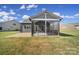 Covered patio with screened enclosure and paver patio at 730 Bushel Dr, Fort Mill, SC 29715