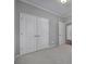 Two-door closet and carpet flooring in bedroom at 730 Bushel Dr, Fort Mill, SC 29715