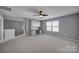 Grey bedroom with built-in desk and fan at 730 Bushel Dr, Fort Mill, SC 29715