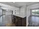 Kitchen island with granite countertop and dark cabinets at 730 Bushel Dr, Fort Mill, SC 29715