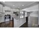 Modern kitchen with stainless steel appliances and large island at 730 Bushel Dr, Fort Mill, SC 29715