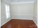 Spacious bedroom with hardwood floors and large window at 9018 Kestral Ridge Dr, Charlotte, NC 28269