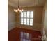 Bright dining room with hardwood floors and chandelier at 9018 Kestral Ridge Dr, Charlotte, NC 28269