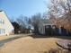 Front yard with landscaping and a paved path at 9018 Kestral Ridge Dr, Charlotte, NC 28269