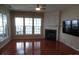 Spacious living room with hardwood floors and fireplace at 9018 Kestral Ridge Dr, Charlotte, NC 28269