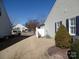 Side yard with grass, shrubs, and a shed at 9018 Kestral Ridge Dr, Charlotte, NC 28269