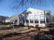 Sunroom addition with large windows and stone base at 9018 Kestral Ridge Dr, Charlotte, NC 28269